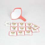 Jogo Imite o Cachorrinho da Materiais para Brincar, com figuras magnéticas de exercícios orofaciais, ossinhos de recompensa e um espelho em forma de boca.