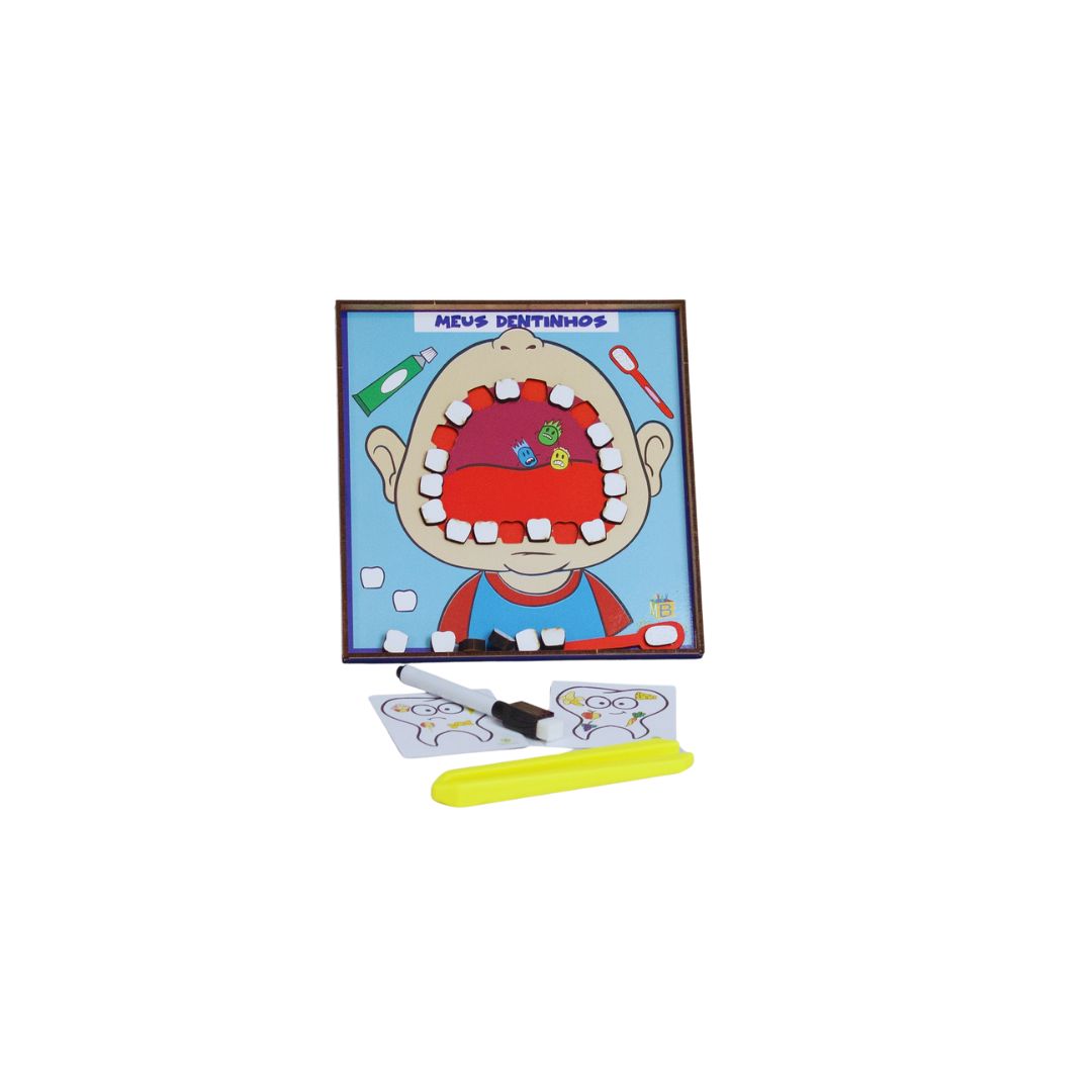 Meus dentinhos 2 Brinquedo Meus Dentinhos da Materiais para Brincar, mostrando um conjunto de dentes de brinquedo e uma escova de dentes em destaque.